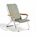 Folding beach chair with aluminum frame and fabric seat in green geometric pattern